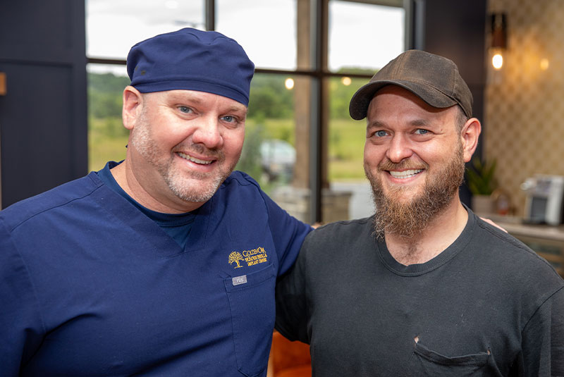 patient and dotor both smiling after patient dental treatment within the dental center