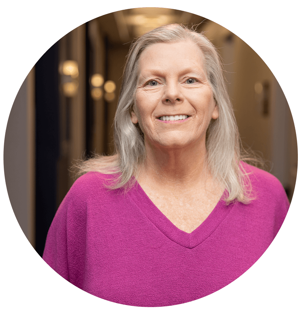 headshot of patient smiling brightly
