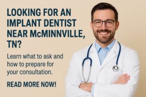 A smiling, senior female patient is sitting in a modern dental chair, consulting with a male implant dentist. The dentist is pointing to a 3D scan of the patient's jawbone on a computer screen, illustrating the implant placement. No text on the image.